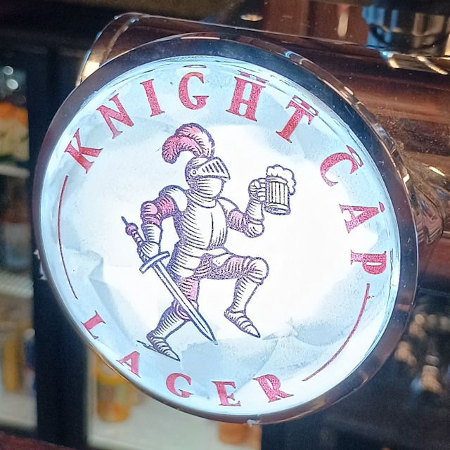 Taken at the Crooked Crown, Liverpool, on 4th November 2025. Ordered as it looked like a new beer, but when I asked for details the barman said it was just re-branded Foster's. Live and learn... Image shows a sketch of a dancing Knight in armour, with a sword in his right hand, and a foaming mug of Beer in his left.